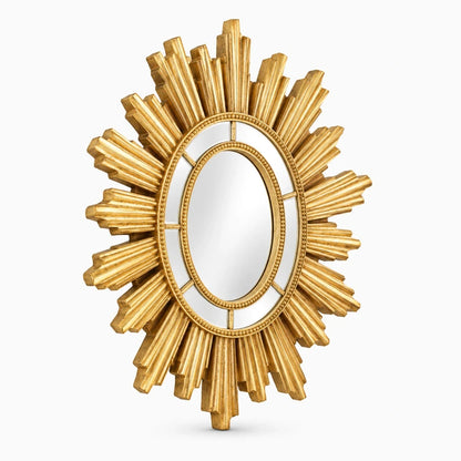 Détail du miroir design salon avec motifs dorés en relief